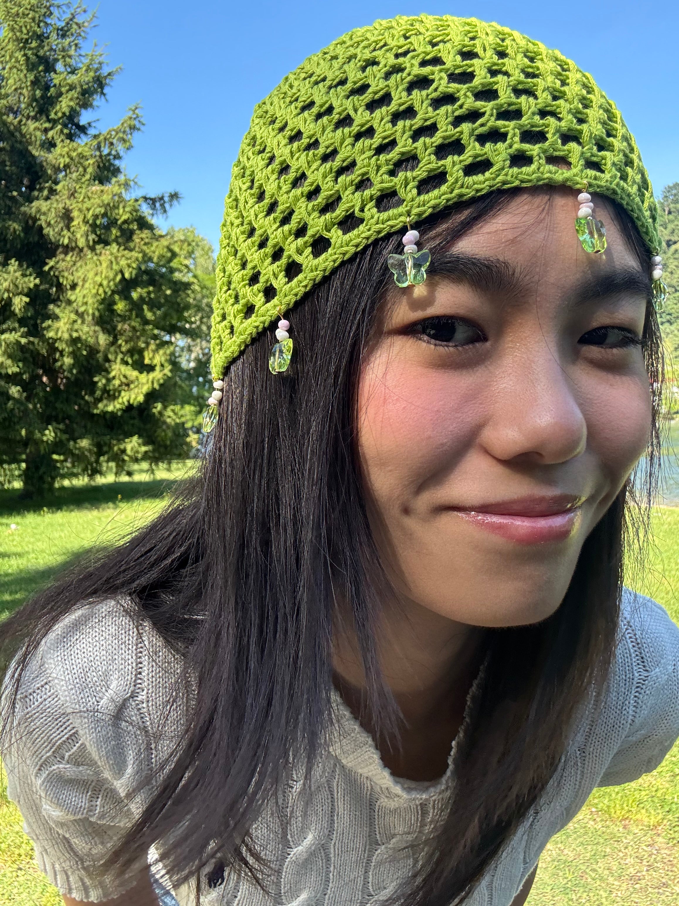 Crochet green mesh hat with butterflies