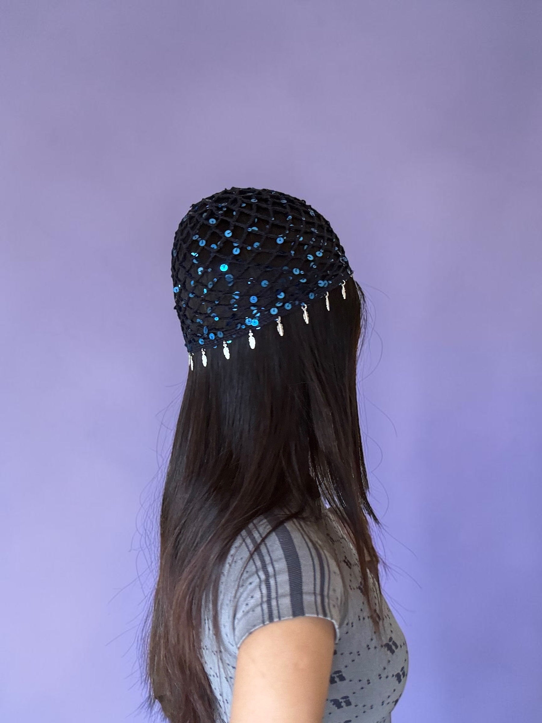 Crochet glittered mesh hat with feathers