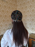 Crochet glittered mesh hat with feathers