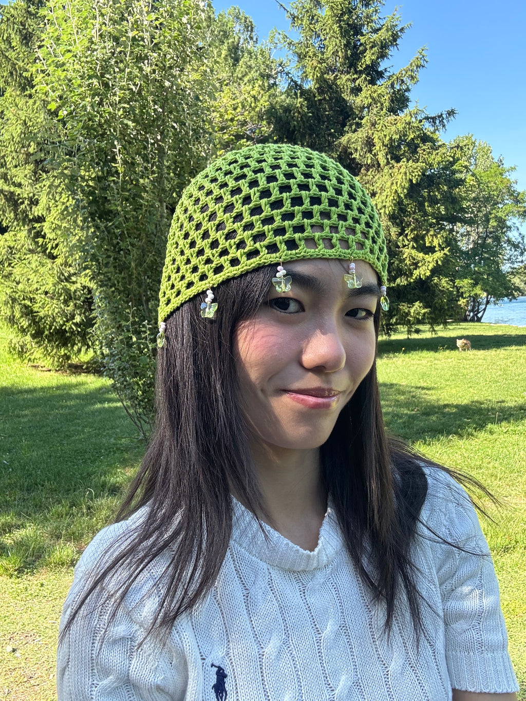 Crochet green mesh hat with butterflies