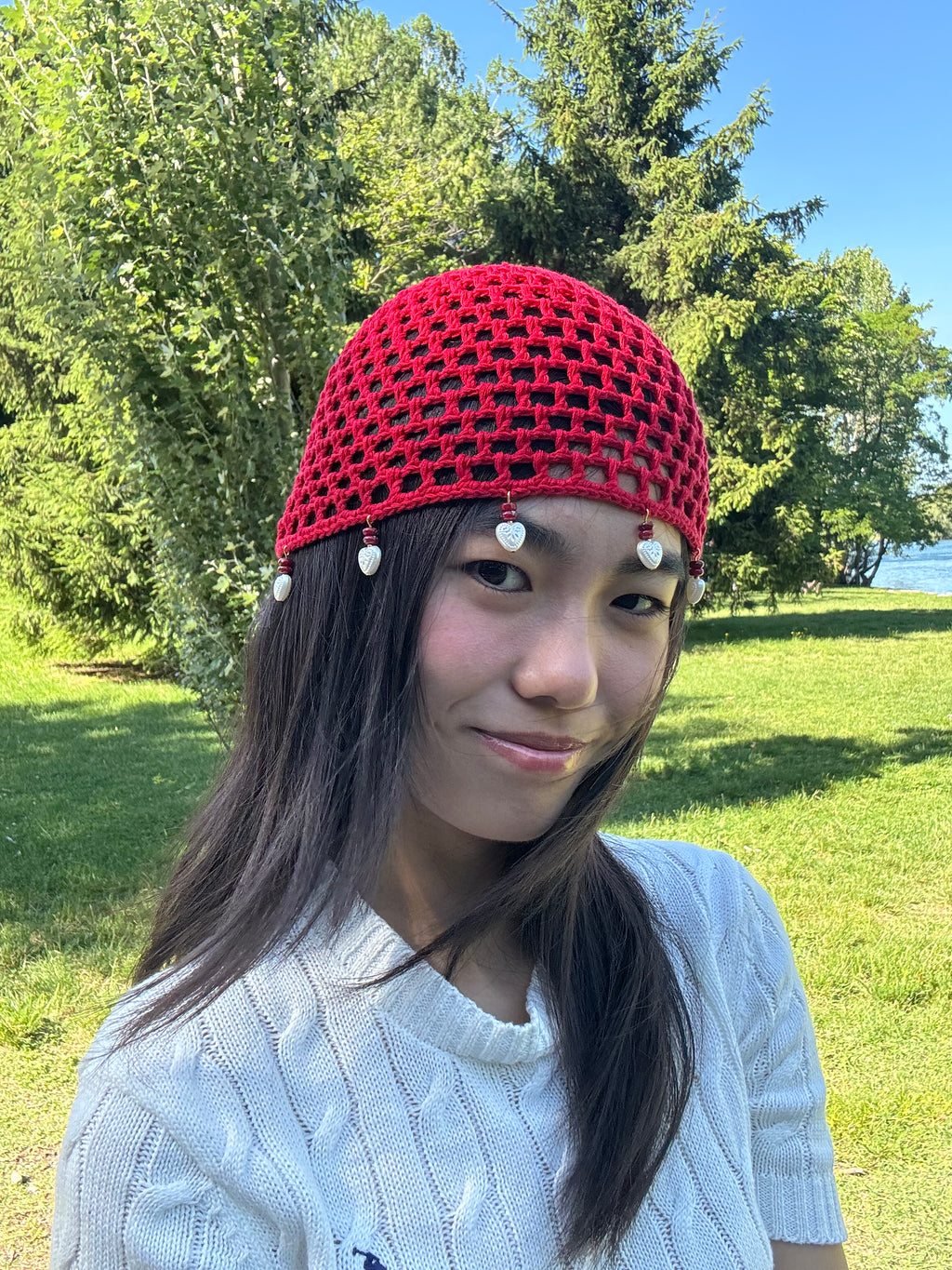 Crochet red mesh hat with hearts
