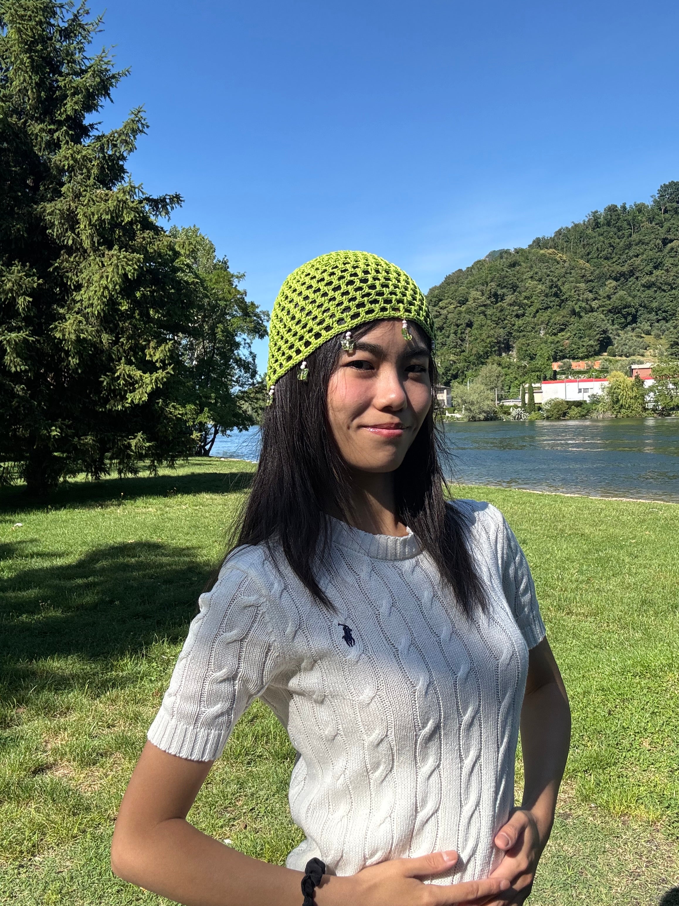 Crochet green mesh hat with butterflies