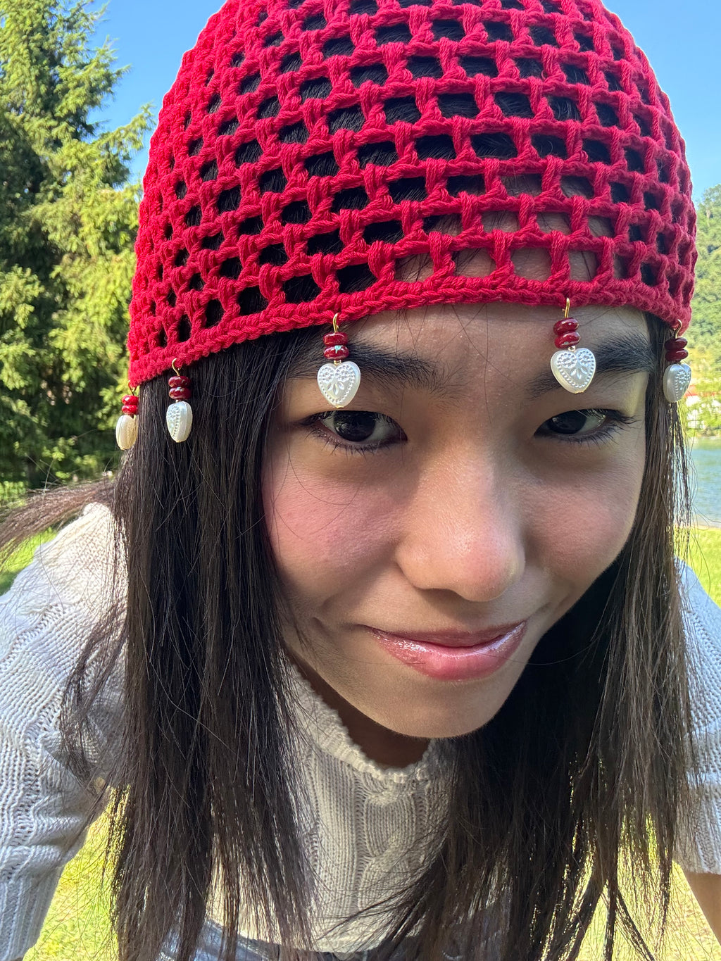 Crochet red mesh hat with hearts