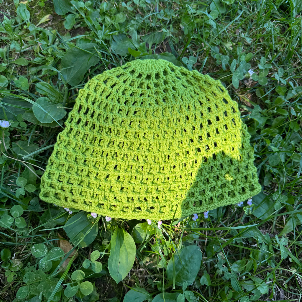 Crochet green mesh hat with butterflies