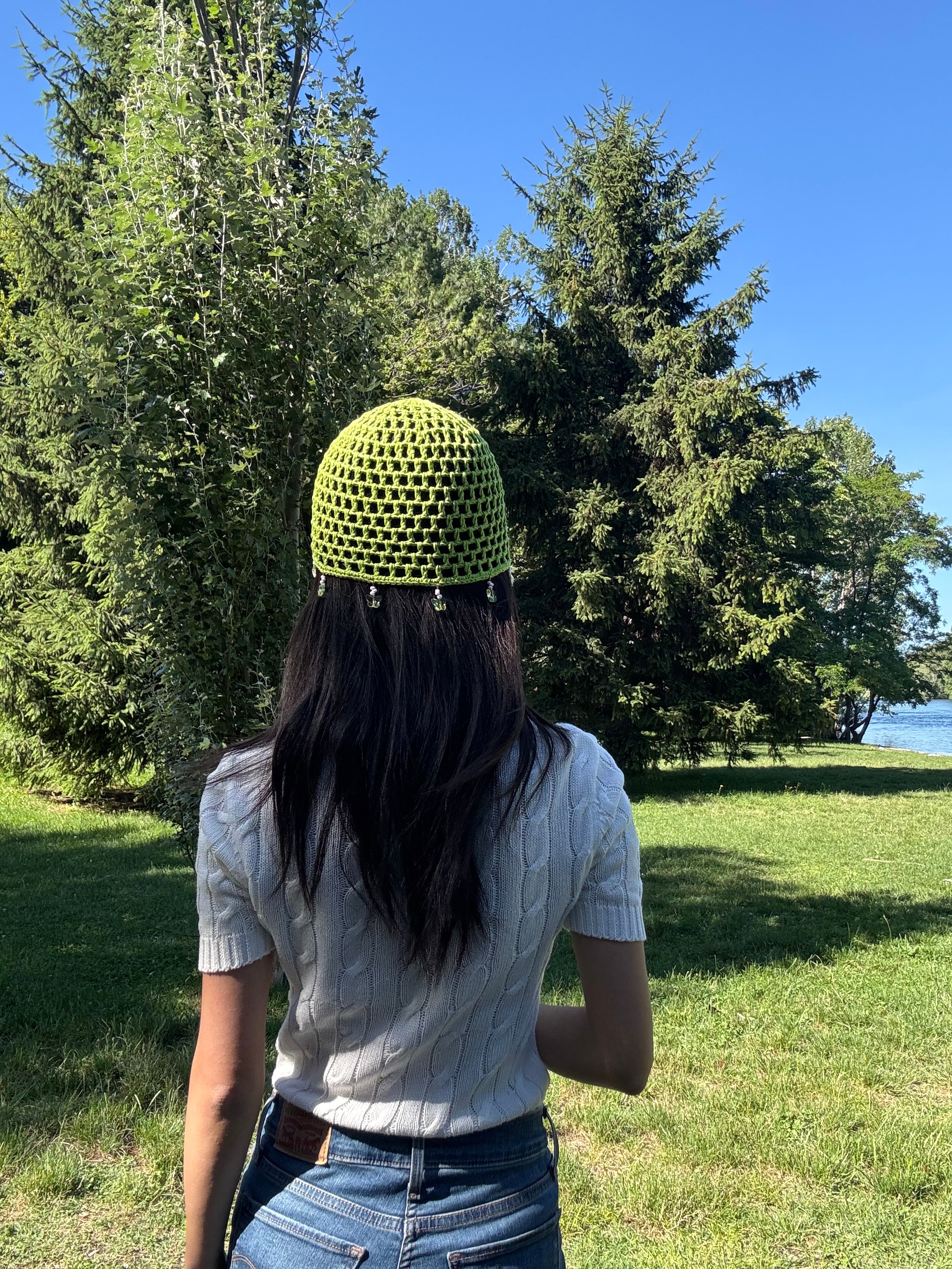 Crochet green mesh hat with butterflies