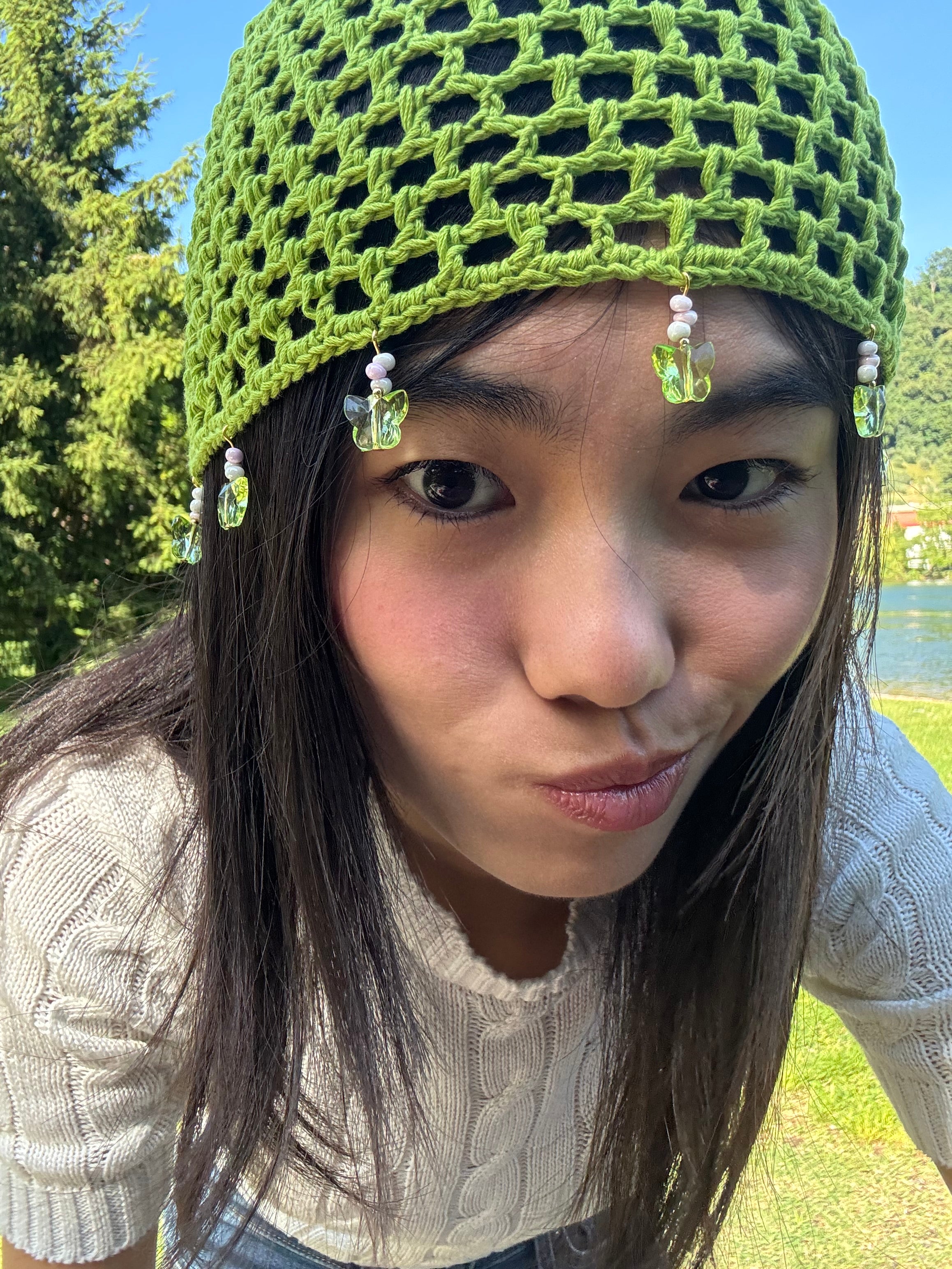 Crochet green mesh hat with butterflies