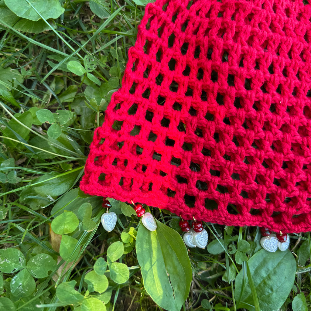 Crochet red mesh hat with hearts