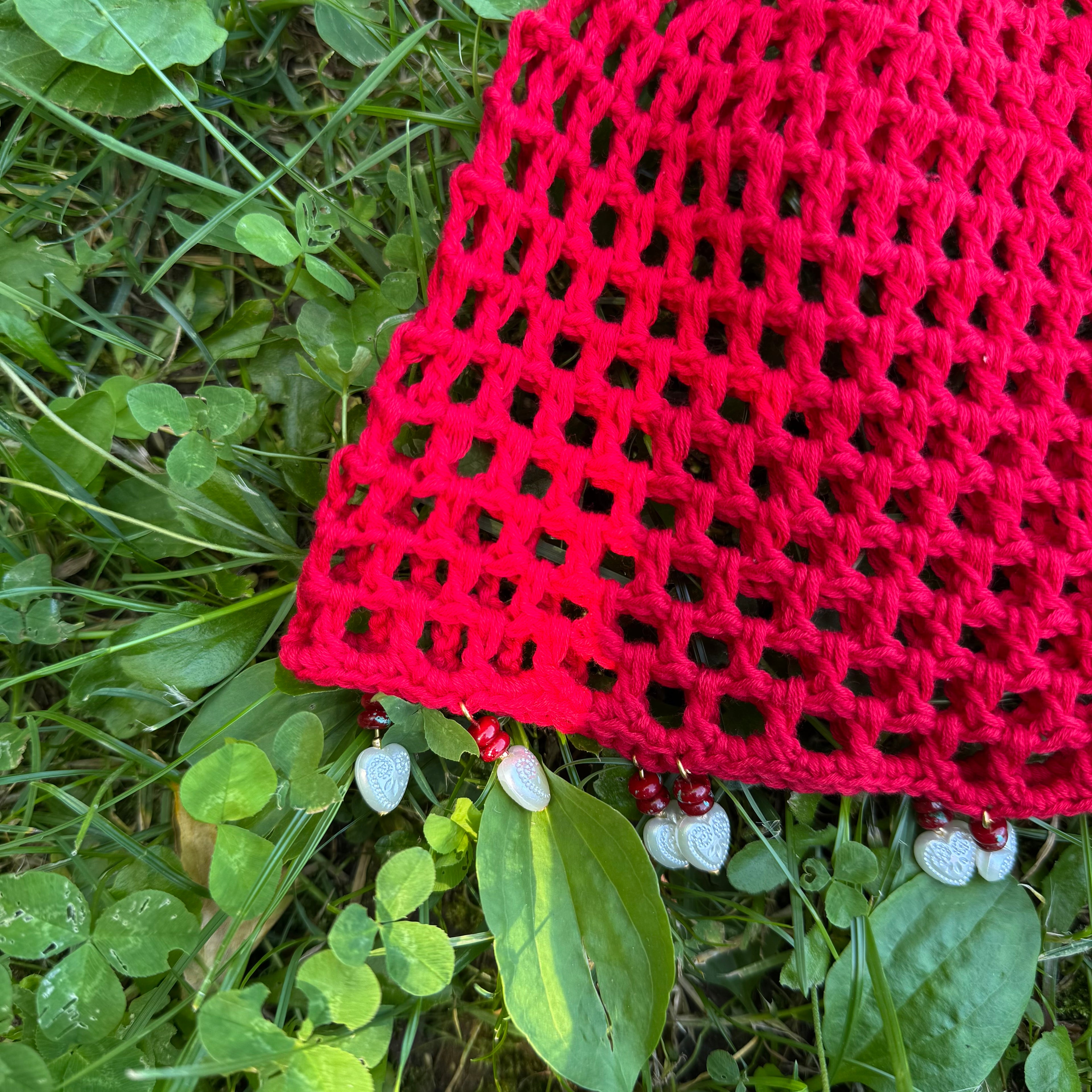 Crochet red mesh hat with hearts