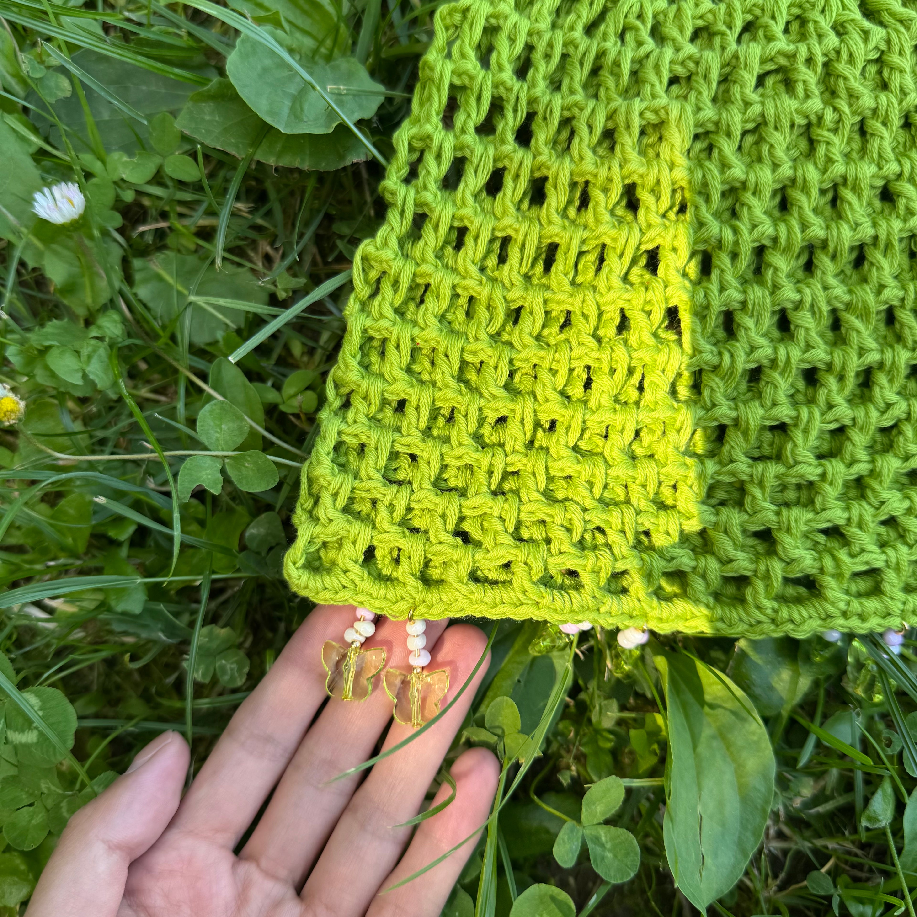 Crochet green mesh hat with butterflies